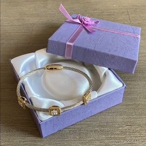 New, never worn, gold & silver cable bracelet.